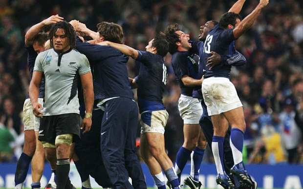 France players celebrate as Rodney So'oialo of New Zealand walks away dejected following the Quarter Final of the Rugby World Cup 2007.